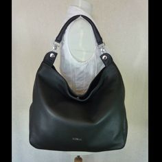 Raffaella Hobo Bag By Furla. Hobo Style Bag Made Of Beautiful Classic Black Pebbled Genuine Leather Hold You Wallet, Keys, Phone And Small Cosmetic Case. Dimensions: 13" Wide Across Bottom X 12" Tall X 4.5" Deep. Single Handle 8" With Folded Top. You Might Find The Drop A Little Small If You Have Big Arm. Snap Magnetic Button Top Closure. Center Compartment With Zipper Closure Two Slip Pockets On Interior Lining Silver Tone Metalware It's In Solid Black Color. Comes Complete With Dustbag Elegant Silver Rectangular Hobo Bag, Silver Elegant Rectangular Hobo Bag, Silver Rectangular Elegant Hobo Bag, Elegant Silver Hobo Bag, Elegant Silver Hobo Shoulder Bag, Luxury Evening Hobo Bag With Silver-tone Hardware, Silver Hobo Bag With Silver-tone Hardware For Evening, Elegant Silver Hobo Bag For Shopping, Chic Silver Leather Hobo Bag