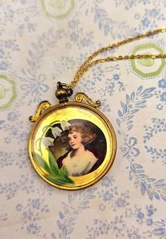 I almost couldn't part with this one. One side of the pendant is a portrait of a young boy and girl in a light red dress. The flip side has a portrait of a young woman and reverse, floral painting detail. Brushed gold-tone with chain. Medallion is 1.5 inches. Light Red Dress, Portrait Necklace, Boy And Girl, Young Woman, Light Red, Floral Painting, Pendant Necklaces, Red Dress, Jewelry Necklace Pendant