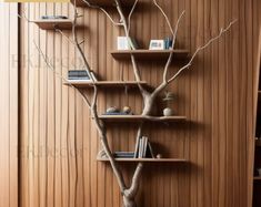 a tree is in the corner of a bookshelf