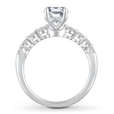 a white gold engagement ring with an intricate design