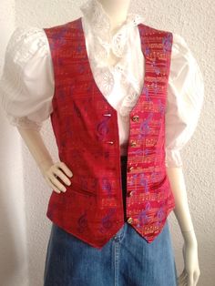 2000 red vest, musical notes print vest, jacquard funny vest, spring red vest, tailored gilet, two pockets, disco vest, pop-art vest.  vintage items always show signs of being worn  please check the measurements before ordering  measurements laying flat : shoulders :34 cm (13 inches)  bust :44cm (17,5 inches)  waist :41 cm (16 inches)  total lenght :57cm (22,5 inches) Red Fitted Vest For Spring, Fitted Red Vest For Spring, Retro Red Sleeveless Vest, Red Sleeveless Retro Vest, Retro Red Cotton Vest, Red Retro Cotton Vest, Red Cotton Retro Vest, Red Vest With Pockets For Spring, Retro Red Fitted Vest