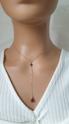 This necklace is made with 14k gold filled chain, 14k gold filled clasp and natural Amethyst beads and briolette.  Please contact me in case you have any questions. Dainty 14k Gold-filled Lariat Necklace, 14k Gold Filled Dangle Lariat Necklace Gift, Adjustable Dainty Gold Lariat Necklace, Dainty 14k Gold Filled Adjustable Lariat Necklace, 14k Gold Filled Lariat Necklace As Gift, 14k Gold Filled Lariat Necklace For Gift, Adjustable Dainty 14k Gold-filled Lariat Necklace, Adjustable 14k Gold Filled Lariat Necklace Gift, 14k Gold-filled Lariat Necklace With Delicate Chain For Gift