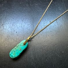 Our December birthstone is TURQUOISE, and once again we have some lovely gemstones to use in our earrings and necklaces! This beautiful, raw Turquoise gemstone is 1" tall x 9/16" wide x 1/4" thick. It is suspended from our small 24K GOLD VERMEIL Bail, wrapped with 14K gold wire, and it hangs from an 16"/18" adjustable 14K GOLD fill chain. Turquoise is perhaps the oldest decorative stone in mankind's history, the Taliswoman of Kings and Queens, Shamans, and Warriors. It is a stone of protection, Turquoise Pendant Necklace For Healing, Healing Turquoise Jewelry With Ethical Gemstones, Hand Forged Turquoise Jewelry Gift, Untreated Turquoise Pendant Jewelry, Hand Forged Turquoise Pendant Necklace, Turquoise Amazonite Dangle Jewelry, Untreated Chrysocolla Turquoise Jewelry, Turquoise Teardrop Amazonite Jewelry, Hand-strung Turquoise Necklace As Gift