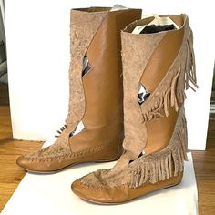 "Vintage 70s bohemian fringe suede leather knee-high mid calf flat moccasin boots made in Spain.  Tan camel with cut outs.  Good condition with a few minor marks.  Sold as is. Says 8.5 but fits more like 7-7.5 us Feet 9-95\" should work best. Final sale, consider this a virtual yard sale!" Bohemian Knee-high Leather Boots, Bohemian Suede Boots With Tassels, Bohemian Brown Suede Boots, Bohemian Style Fringe Suede Boots, Bohemian Suede Fringe Boots, Bohemian Suede Boots With Fringe, Bohemian Boots With Flat Heel For Festival, Spring Bohemian Suede Boots, Brown Tasseled Boots For Festivals