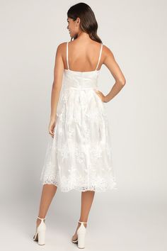 Achieve the picture-perfect romantic look with the Lulus My Darling Daydreamer White Lace Bustier Midi Dress! A sheer mesh overlay is adorned with intricate floral embroidery (atop a satiny woven liner) as it forms adjustable straps, a sweetheart neckline, and a bustier bodice with padded, underwire cups. The set-in waist boasts strips of hidden boning before flowing into an A-line midi skirt with scalloped trim. Hidden back zipper/clasp. Fit: This garment runs small - please size up. Length: Kn Bustier Midi Dress, Embroidered Midi Dress, Lace Bustier, White Midi, My Darling, Bustier Dress, Romantic Look, Scalloped Trim, Mesh Overlay