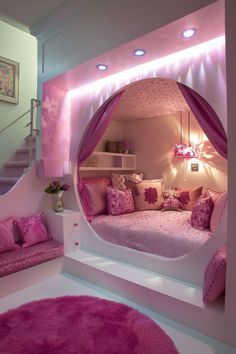 a bedroom with pink and white decor on the walls, carpeted flooring and stairs