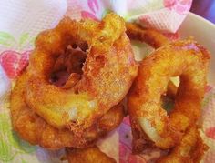 fried onion rings in a bowl on a table