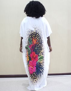 This dashiki is a traditional African garment that is perfect for any occasion. It is made of soft, breathable cotton fabric that will keep you comfortable all day long. The dashiki has a loose fit that allows for a comfortable and modest drape. It also has long, fitted sleeves. The dashiki is decorated with beautiful African prints that add a touch of elegance and sophistication. Processing Time : 20-25 Business Days Made of soft, breathable cotton fabric Loose fit for a comfortable and modest Casual White Kaftan For Beach Cover-up, White Oversized Printed Dress, White Graphic Print Dress For Vacation, Cotton Graphic Print Dresses For Vacation, White V-neck Kaftan Casual Style, Casual White V-neck Kaftan, White V-neck Casual Kaftan, Casual White Long Sleeve Kaftan, Casual White Short Sleeve Kaftan