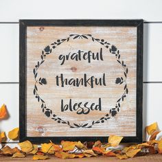 a wooden sign that says grateful thanksgiving blessing on it, surrounded by leaves and pumpkins