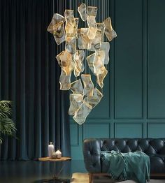 a living room filled with furniture and a chandelier hanging from it's ceiling