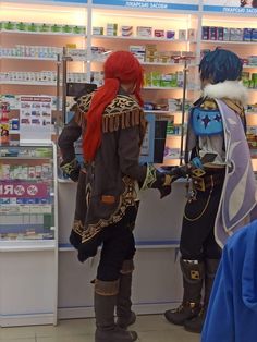 two cosplayes are standing in front of a pharmacy counter with their backs to the camera