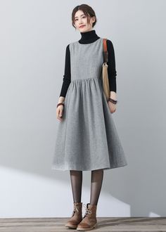 "FEATURES * 25% wool, other fiber,nylon * Polyester lining * Two side seam pockets * Sleeveless wool dress * A-Line wool dress * Casual wool dress * Perfect for winter, autumn * Dry clean * Black blouse is not sale items * Size XS-Sample is ready to ship, Only 1 available, don't accept refund, exchange * The model is 170 cm (5′ 7″) tall with a 80 cm (31.5\") bust, 66 cm (26\") waist. She is wearing the wool dress in size XS. ★★ Get your size in Size Chart with your body measurement https://www.e Sleeveless Workwear Dresses With Slip Pockets, Sleeveless Dresses With Pockets For Fall, Chic Sleeveless Winter Dress, Casual Sleeveless Dress For Fall Workwear, Casual Sleeveless Dress For Work In Fall, Chic Sleeveless Midi Dress With Pockets, Fall Midi Length Sleeveless Dress For Work, Knee-length Sleeveless Dress With Pockets For Work, Sleeveless Gray Dress For Winter