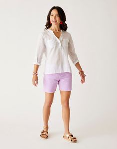 Simple sophistication make this lightweight summer top a weekend bag must. Chest pockets and three button open V-neck dial in the vibe in stride. Spring Beach Tops With Pockets, Beach Spring Tops With Pockets, Summer Tops With Pockets For Vacation, Summer Tops With Pockets In Relaxed Fit, Relaxed Fit Summer Top With Pockets, Summer V-neck Top With Pockets, Everyday Summer Top With Pockets, Summer Everyday Tops With Side Pockets, Casual Tops With Roll-up Sleeves For Vacation