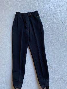 "Vintage black ski pants with stirrups to keep pants tucked into your boots. Wide banded waist with zipper fly and double snap closure. Excellent vintage condition! label: Edelweiss Skiwear fabric: 64% nylon, 34% wool, 2% lycra size: labeled size is 8, however, modern size is smaller. Please check measurements for an accurate fit. Questions are welcome! Pants were measured across the front side lying flat. There is slight stretch. waist 12 1/2\" hips 16 1/2\" total length to bottom of stirrup 38 Blue Picnic, Bombshell Dress, 40s Dress, White Lace Maxi Dress, Boots Wide, White Lace Maxi, Cropped Pants Women, Sports Trousers, Belted Pants