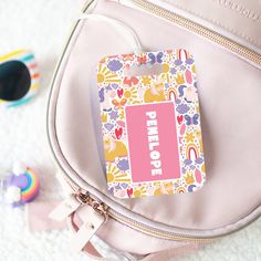 Discover the cutest personalized bag tags for kids! Ideal for back-to-school use on backpacks, sports bags, luggage, and diaper bags - the possibilities are endless!  Proudly made in the USA, these tags are durable and water-resistant. Each tag comes with a clear acrylic tie for effortless attachment. Customize the back with your contact information to ensure your little one's bag is never lost again! Stay organized and stylish with these practical and adorable personalized bag tags. Personaliza Trendy Bags For Daycare And Back To School, Customizable White Rectangular Backpack, Customizable Multicolor Bag For Back To School, Personalized Travel Bags For Back To School, Customizable Multicolor Back-to-school Bag, Playful Rectangular Backpack For Back To School, Cute Personalized Daycare Bag, Playful Personalized Back-to-school Bag, Cute Customizable Backpack For Travel