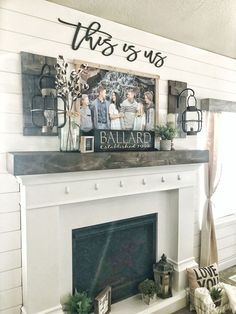 a white fireplace with some pictures on the mantle