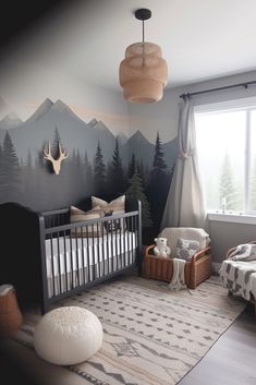 a baby's room with mountains and trees painted on the wall