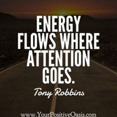 an empty road with the words energy flows where attention goes, tony robbins