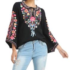 Black Floral Embroidered Long Sleeve Blouse Boho V Neck Tunic Top Cottagecore Bohemian Flowy Top Embrace The Perfect Union Of Classic Beauty And Contemporary Trends With This Gorgeous Embroidered Tunic Top. This Captivating Piece Showcases Intricate Floral Embroidery, Striking The Perfect Balance Between Romance And Sophistication. Keyhole, V-Neckline And Long Sleeves Add A Touch Of Allure, While The Flowy Silhouette Provides A Flattering Fit. Add Some Personality To Your Look With This Stunning Black V-neck Blouse With Floral Embroidery, Floral Embroidered Top For Fall Vacation, Bohemian Black Tops With Embroidered Neckline, Floral Embroidered Top For Vacation In Fall, Black Embroidered Long Sleeve Top For Summer, Black Long Sleeve Embroidered Top For Summer, Black Long Sleeve Embroidered Top, Black Floral Embroidery Festival Top, Embroidered Tops For Fall Vacation