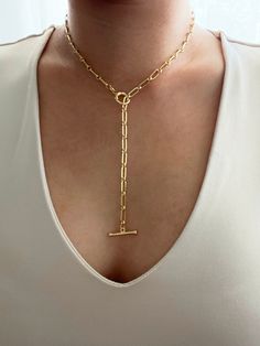 18k gold plated paperclip lariat y necklace with a toggle front clasp. Necklace drop can be adjustable and tailored to your liking. Necklace can be worn in multiple ways. You can opt to have a drop which gives it a lariat look or you can opt not to have a drop which give you a regular toggle front necklace look. It is of great importance to me that I make jewelry for my customers that I, myself, wear every day. Each jewelry piece is handmade by me personally with love and care. Each item is craf Gold Toggle Necklace With Paperclip Shape, Gold Lariat Toggle Necklace With Paperclip Chain, Gold Lariat Necklace With Lobster Clasp, Everyday Gold Lariat Necklace With Paperclip Chain, Everyday Lariat Chain Necklace With Toggle Clasp, Formal Lariat Toggle Necklace With Chain, Formal Lariat Toggle Necklace, Gold Lariat Toggle Necklace With Adjustable Chain, Formal Lariat Toggle Necklace With Adjustable Chain