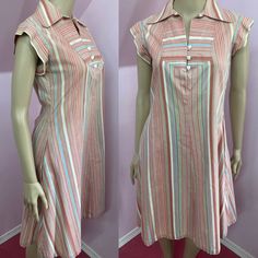 "Adorable 1970s striped a-line dress has Wide collar inside hip pockets, capped sleeves & buttons down bodice. Fabric is cotton and has white, shades of brown, green and aqua blue stripes. White plastic heart buttons. Interfacing has some puckering otherwise, Overall Excellent Condition Freshly washed No label (appears to be house made) Fits XS/S Measurements are Bust 34\" Waist 32\" Hips 46\" Shoulders 14.5\" Sleeves 2.25\" Length 37.5\" Sweep @70\"" Retro Striped Knee-length Dress, Retro Striped Lined Dress, Vintage Short Sleeve Striped Dress, Retro Striped Dresses With Buttons, Striped Retro Dresses With Buttons, 1970s Outfits, Retro Summer Dress, Aqua And Green, Hostess Dresses