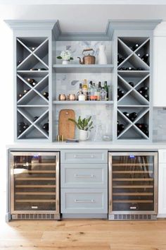 a kitchen with two wine coolers in it