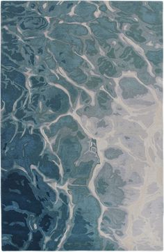 a blue and white rug with water ripples on it