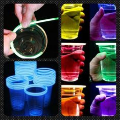 several different colored plastic cups being filled with liquid and then put in the same cup