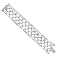 A modern wide, diamond and white gold bracelet, set with round brilliant-cut diamonds, in four claw settings, in an articulating, cross hatch, trellis like pattern, with a diamond set border, mounted in 18ct white gold, with a box and tongue clasp, and figure-of-eight safety clasps, with a European 750 mark, circa 2000. Estimated total stone weight 22.17 carats. Gold Bracelet Set, Bath And Body Works Perfume, Large Bracelet, White Gold Bracelet, Delicate Jewelry, Jewelry Inspo, Round Brilliant Cut Diamond, Brilliant Cut Diamond, Body Works