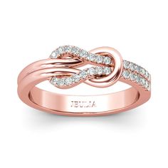 an 18k rose gold ring with white diamonds on the band and two intertwineded bands