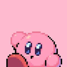 an image of a pixelated pink doughnut with eyes on it's face