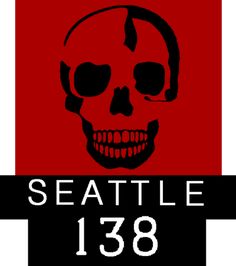 a red and black sign with a skull on it's side that says seattle 138