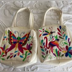 Cute Cream Color And With A Colorful Embroidery Design Hand Bag. This Were Made In Mexico By My Aunt. Color: Cream And Colorful Embroidery Measurements, See Photos. Non-Smoker/Pet Free Home Two Different Designs, See Photos. Please Comment On The One You’re Interested. Multicolor Bags With Embroidered Logo For Everyday Use, Multicolor Floral Embroidery Shoulder Bag As Gift, Everyday Multicolor Embroidered Bag, Embroidered Multicolor Bags For Gifts, Pink Embroidered Bags For Everyday Use, Multicolor Embroidered Tote Shoulder Bag For Daily Use, White Rectangular Bags With Machine Embroidery, Pink Handheld Embroidered Shoulder Bag, Multicolor Embroidered Tote Bag For Daily Use