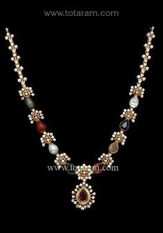 22 karat gold necklace with navrathan stones & cz 
  
    note: this item does not have a diamond in it, the white stone shown is a cz.
  necklace has 8 precious stones which include ruby, emerald, coral, pearl, cats eye, garnet, yellow saphire & blue saphire. - 235-GN4368 - in 25.050 Grams for USD $2,876.83 USD. 
Made in India by Totaram Jewelers Online this product is in Gold - 22 Karat BIS Hallmark 916 Gold  & is an excellent gift for Adult - Women. Ships fully insured with secured guaranteed 22k Gold Necklace With Stone Work As Gift, 22k Gold Temple Necklace With Gemstones, Traditional Multi-stone 22k Gold Necklace, Elegant Gold Multi-stone Temple Necklace, 22k Gold Multi-stone Temple Necklace, 22k Gold Necklace, Antique Jewelry Indian, Ruby Emerald, Cz Necklace