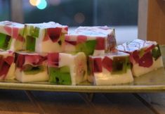 there are many pieces of food on the plate together, and one is cut into squares