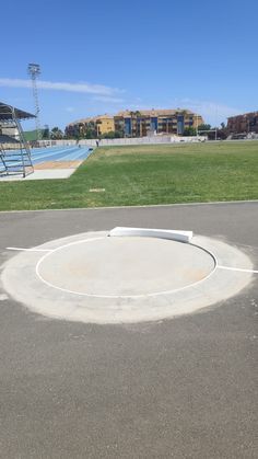 an empty parking lot in front of a swimming pool