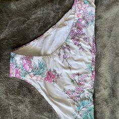 This Bikini Bottoms Are White With Pastel Flowers On Them. They Are Brand New With Tags And The Hygiene Liner. By The Way The Tag On The Inside Is It Is Quite Possible They Are Reversible But Even If They Aren’t Supposed To Be I’m Sure They Would Be Completely Fine Being Reversed To The White Side With The Pattern On The Top Band. White Swimwear For Vacation Swimming, White Tropical Print Tankini For Spring, White Summer Bottoms For Pool, White Tropical Print Spring Tankini, White Stretch Bottoms For Beach Party, Spring White Tropical Print Tankini, Printed White Tankini For Vacation, White Printed Tankini For Vacation, White Beachy Bottoms For Beach Party