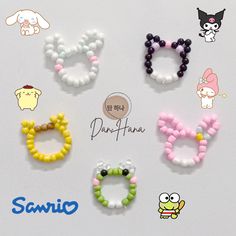 six pairs of beaded bracelets are displayed on a white surface with the words sanrio written below them