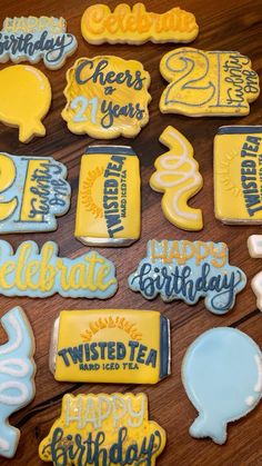 decorated cookies are arranged on a wooden table