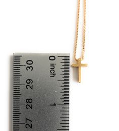 "Dainty Cross Necklace This is a delicate and minimalist 24K gold plated box chain with a 24k gold plated dainty cross through it. It is adjustable from 17.5\" to 19.5\" / 45cm to 50 cm This simple piece would be a perfect accessory for a bride, first communion, confirmation or as an everyday necklace that goes with anything. This necklace is designed to be worn all day. DETAILS: Necklace length: 17.5\" / 45 cm plus 2\" extension chain 24K Gold plated charm Cross measures: 0.5\" / 1 cm It is car Gold Crucifix Charm Necklace In Minimalist Style, Gold Minimalist Crucifix Charm Necklace, Minimalist Gold Crucifix Charm Necklace, Minimalist Gold Cross Necklace As Gift, Simple Gold Cross Necklace As A Gift, Elegant Cross Necklace With Box Chain For Gift, Gold Cross Necklace With Delicate Chain As Gift, St Jude Necklace, Dainty Cross Necklace