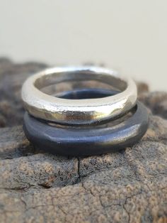 This is a Silver band asymetrical ring. It is a chunky ring with a dome shape. A Minimalist band ring that can be stackable. This ring can fit a men or a women. A unisex band ring. It can be a wedding ring or a casual everyday ring. Just choose your ring size and your finish. This listing is for one band. the ring is also available in14 karat solid gold. To see it please reffer to the solid gold section: https://www.etsy.com/il-en/your/shops/TamyZurTachshit/tools/TamyZurTachshit/il-en/listings/s Minimalist Handmade Wide Band Promise Ring, Modern Adjustable Rings With Thick Band, Modern Stackable Couple Rings With Open Ring Design, Modern Open Ring With Ring Detail, Modern Stackable Couple Open Rings, Modern Stackable Open Couple Rings, Handmade Minimalist Round Band Rings, Minimalist Handmade Rings With Round Band, Minimalist Handmade Round Band Ring