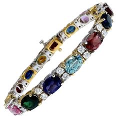 Assorted Gem Line Bracelet. 24ct. Natural Ruby, Multicolor Sapphires, Emeralds, Aquamarines, Pink-Red Tourmaline, Amethyst & Garnets. Average: 6 x 8mm 2.50ct natural Round Diamonds H-color Vs-2 clarity. Secure pressure clasp and safety catch. 25.1 grams. 14kt. white & yellow gold. Measures 7 inches (wearable length) $23,000 Appraisal Certificate to accompany Most Expensive Jewelry, Red Tourmaline, Bracelet Tennis, Aquamarine Bracelet, Tanzanite Diamond Ring, Tanzanite Diamond, Tourmaline Bracelet, Gold Cocktail Ring, Gold Cocktail