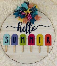 a sign that says hello summer on top of popsicles with the word'hello summer '