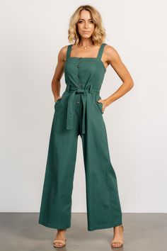 Baltic Born exclusive style Adorable jumpsuit for a day out on the town Deep Kelly green color Linen blend material has no stretch Straight neckline Functional buttons down bodice Tank sleeves Hidden pockets on both sides Removable self-tie belt at waist Wide-leg pant style Unlined Trina is 5'6, cup size 32D, size 2 and is wearing size S Green Overall Jumpsuit For Day Out, Sleeveless Green Overalls, Green Sleeveless Overalls, Green Sleeveless Solid Color Overalls, Fitted Green Overalls For Spring, Casual Green Jumpsuits And Rompers For Work, Fitted Green Overalls For Workwear, Casual Green Jumpsuits For Workwear, Cotton Jumpsuits And Rompers With Buttons For Day Out