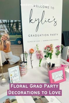 a table topped with pictures and flowers next to a sign that says floral grad party decorations to love