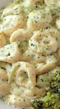 broccoli and dumplings are in a white bowl