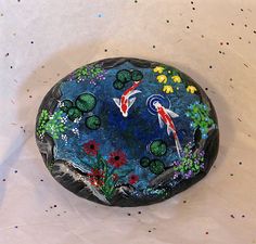 a painted rock sitting on top of a table