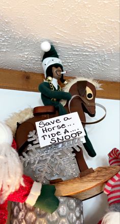 a wooden rocking horse with a sign that says save a horse, ride a sleigh