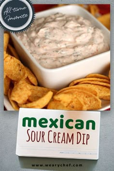 mexican sour cream dip with tortilla chips on the side and a sign that says,