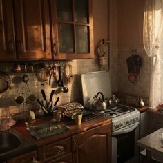 a kitchen with a stove top oven sitting next to a sink and countertop covered in pots and pans